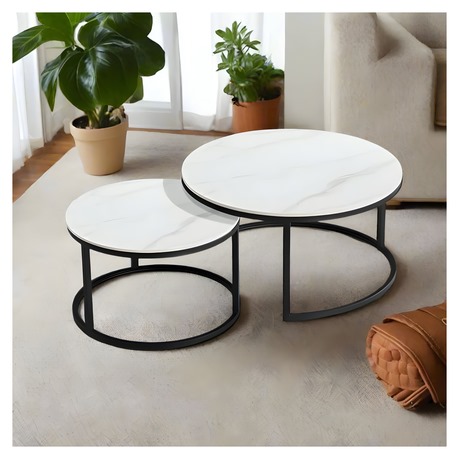 Set of two modern nesting coffee tables with round white marble tops and black metal bases