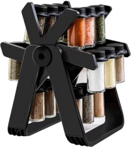 Rotating Ferris wheel spice rack with 16 glass jars on a kitchen counter.